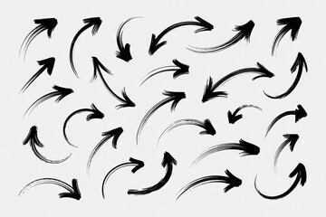 Fototapeta premium Black ink brushstroke arrows on a white background showcasing dynamic movement and direction.