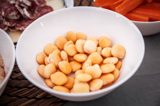Close-up of lupins, sweet lupin beans, or altramuces or tremocos, served as a ready-to-eat appetizer, highlighting and selective focus typical of Mediterranean culinary traditions in Valencia, Spain.