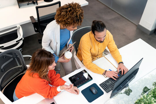 Business colleagues working together in modern office - Powered by Adobe