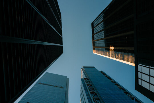 Low-Angle View of Modern Skyscrapers Against Clear Sky