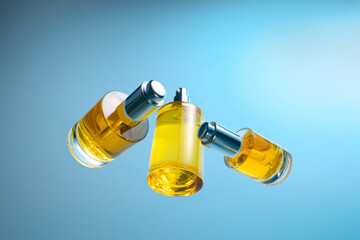 Elegant Perfume Bottles Arranged Against a Gradient Blue Background