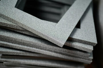 Creative foam frames stacked for crafting and gift box filling in a workshop setting