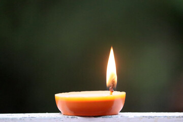 round candle is burning.