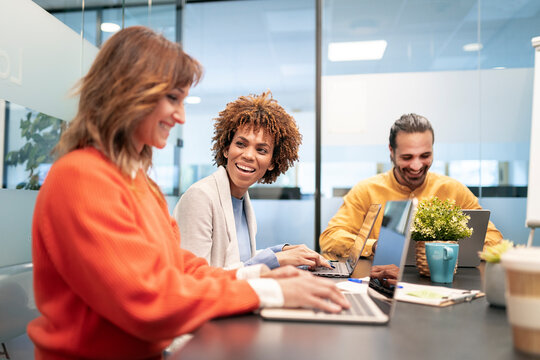 Business people collaborating during meeting in modern office