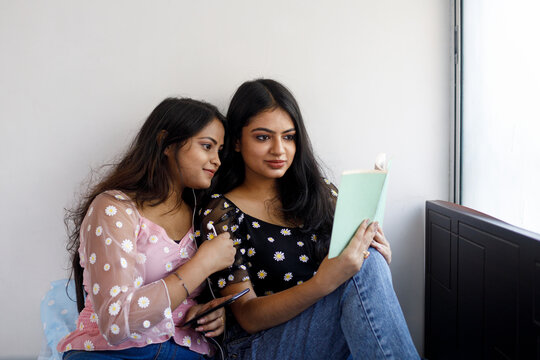 Two female friends spending leisurely time together 
