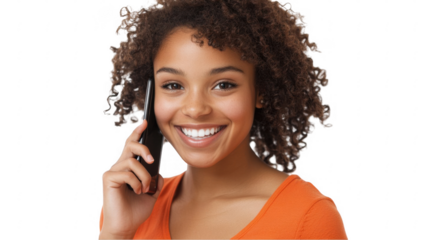 Happy young woman smiling while talking on mobile phone indoors
