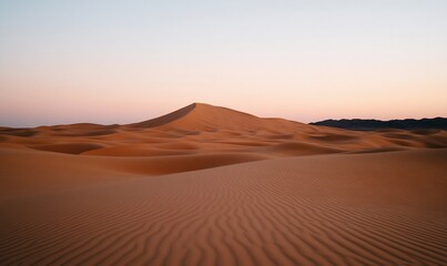 Serene desert landscape at dawn, with gently sloping sand dunes under a soft, pale sky
