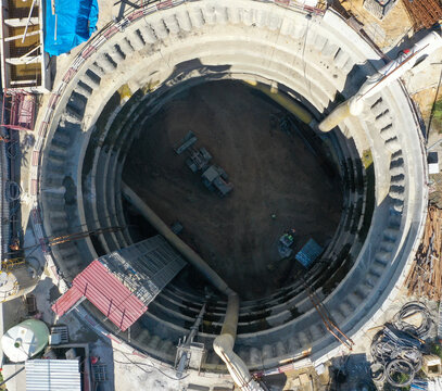 excavator excavation in a circular underground shaft