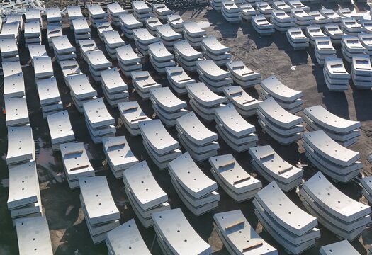 Rows of Concrete Tunnel Segments Stored at a Construction Site