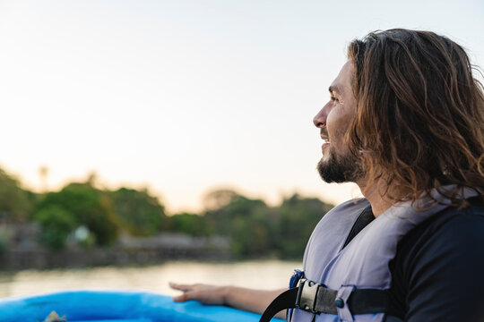 Man Enjoying Sunset on the Water