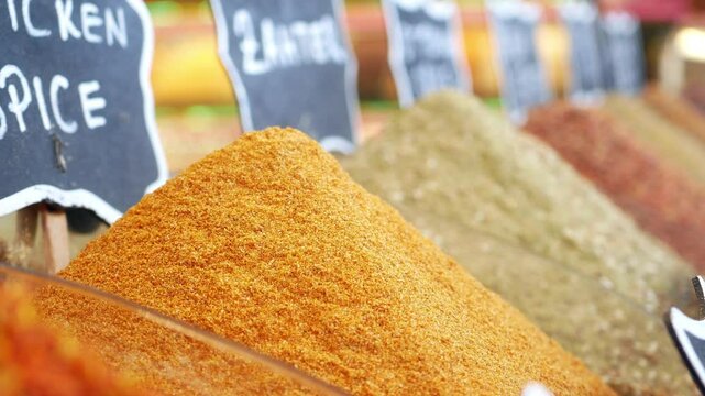Colorful spices displayed at local market in vibrant setting