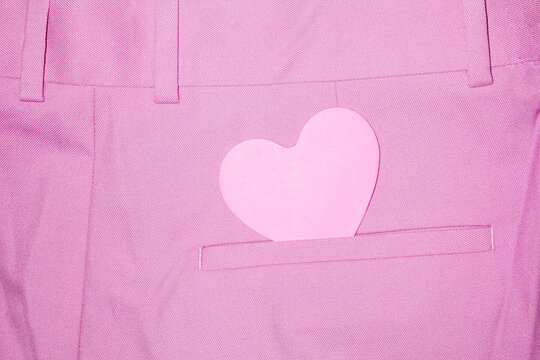 Naklejki Close-up of pink formal trousers and heart-shaped pink love note