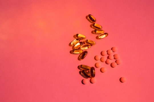 Vitamins, pills and supplements in a rosy light