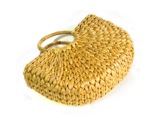 Handmade bag made by utilizing natural water hyacinth material, isolated on white background. concept of rural local wisdom, product from waste to reduce global warming.