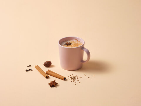 Warm Spiced Latte With Cinnamon and Star Anise on Minimal Background
