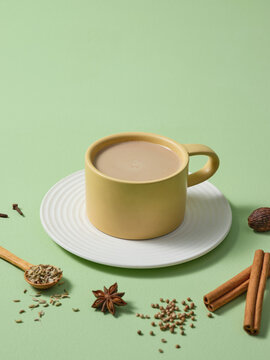 Warm Spiced Chai Tea in a Stylish Mug with Ingredients on Display