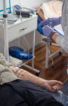 Nurse preparing IV for patient