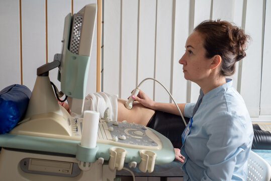 Doctor does an ultrasound of the abdomen