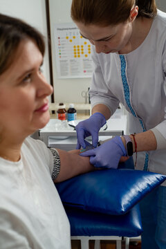 Nurse taking blood from a patient's vein