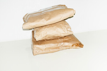 Brown paper mail delivery transport packages with hard direct flash
