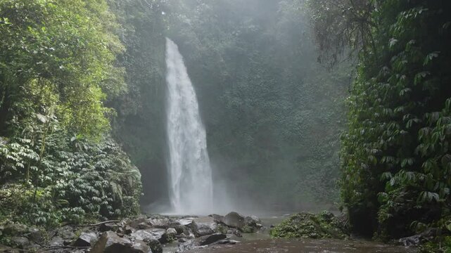 Nungnung waterfall Air Terjun Nungnung in the breathtaking northern region of Bali, Indonesia surrounded by forests and one of the tallest