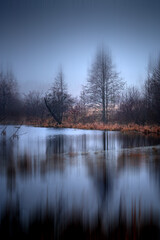 Lake on an autumn foggy morning. Autumn landscape. Background for relax.