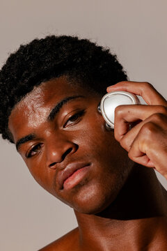 Close-Up of Man Using Microcurrent Device