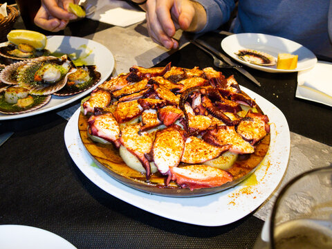 Delicious octopus with potatoes and paprika enjoying spanish tapas