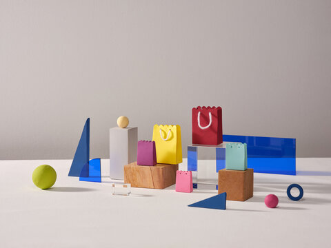 Abstract Composition With Colored Bags and Geometric Shapes on