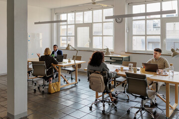 Formal business people working in a modern open space office