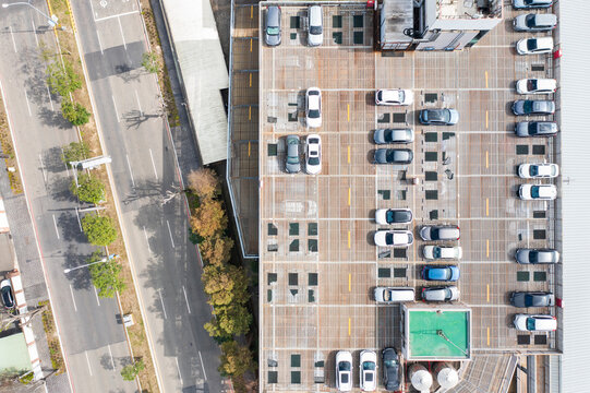 Aerial View Modern Rooftop Parking Deck with Cars Urban Design