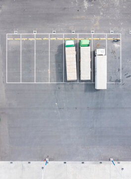 Aerial View Semi Trucks Parked in Logistics Terminal Yard