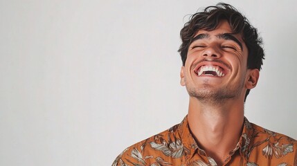 Young Brazilian Man Smiling Against a Simple White Background