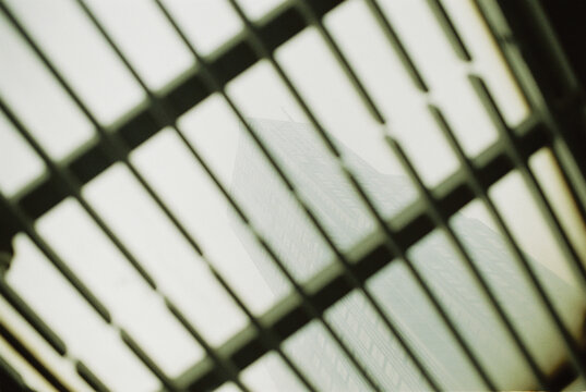 Skyscraper Behind Metal Grid in Hong Kong