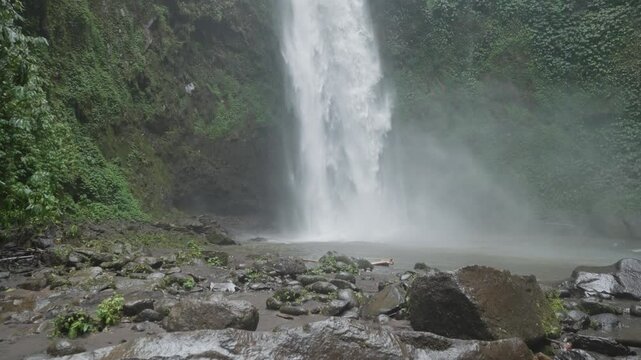 Nungnung waterfall Air Terjun Nungnung in the breathtaking northern region of Bali, Indonesia surrounded by forests and one of the tallest