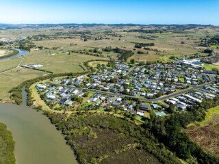 Aerial view of a residential area in New Zealand. The image highlights urban planning and residential architecture in a rural setting. PARAKAI, HELENSVILLE, NZ