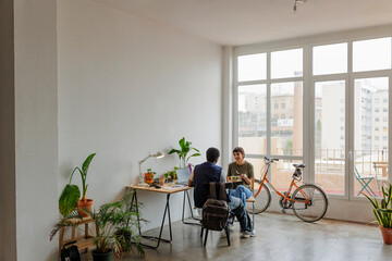 Colleagues having lunch break together in modern office