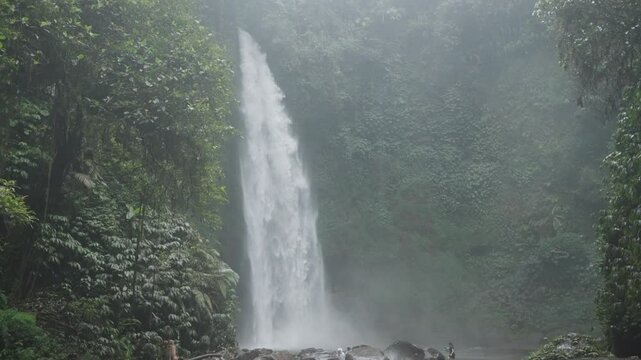 Nungnung waterfall Air Terjun Nungnung in the breathtaking northern region of Bali, Indonesia surrounded by forests and one of the tallest