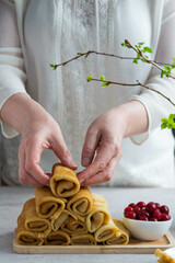 Woman cooking pancakes for breakfast.