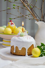 Easter. On the festive table there is Easter cake and painted eggs.