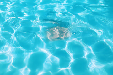 Obraz premium A serene underwater scene showing ripples and reflections in clear, turquoise water, capturing the peaceful essence of nature.