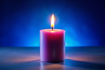 Serene Pink Candle Flame on Blue: Meditation & Relaxation Stock Photo