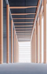 Fototapeta premium Modern architecture featuring slender columns and expansive windows in a bright corridor