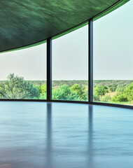 Elegant curved architecture reveals serene natural landscape at midday