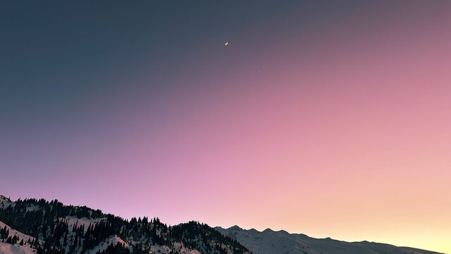 Twilight sky with moon and lone star in blue-pink hues. - Powered by Adobe