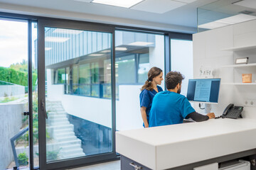 A team of veterinarians analyzing medical data on a computer
