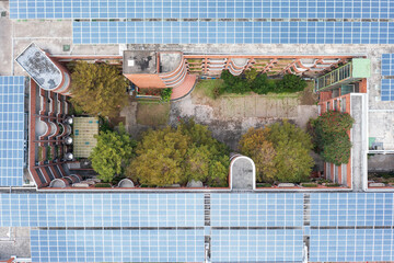 School Courtyard with Solar Panels and Greenery Aerial View