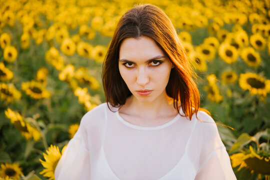 A portrait of a girl in sunflowers