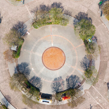 Aerial view of symmetrical circular plaza with trees