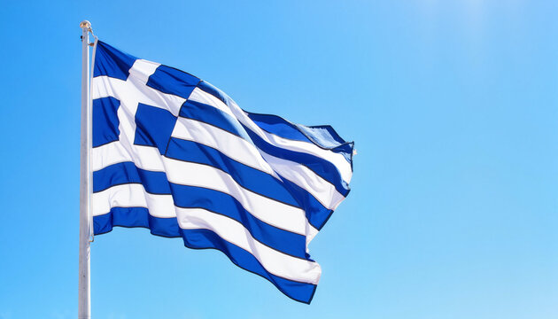Greek flag waving against a clear blue sky  